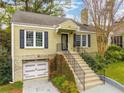Attractive one-story home with beautiful landscaping, updated garage, and inviting front entrance at 51 Willow Wood Se Cir, Atlanta, GA 30317