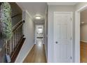 Inviting foyer featuring hardwood floors, staircase, and neutral paint at 102 Defoors Mill Dr, Atlanta, GA 30318