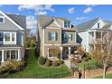 Charming two-story home showcasing the landscaped yard, attractive facade, and inviting front porch at 2172 Haventree Ct, Lawrenceville, GA 30043