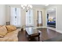 Inviting living room with hardwood floors, neutral walls, and large windows with natural light at 2172 Haventree Ct, Lawrenceville, GA 30043