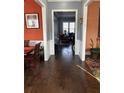 Hallway with hardwood floors showing access to the Dining Room and Living Room at 227 Shellbark Dr, Mcdonough, GA 30252