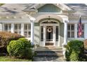 Welcoming entrance featuring a decorative wreath, sidelights, and elegant architectural details at 615 Collier Nw Rd, Atlanta, GA 30318