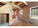 The home features wood floors and a wooden beamed ceiling at 1615 Hilltop Ct, Woodstock, GA 30188