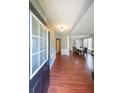 Inviting foyer showcasing hardwood floors and an open view into the adjacent dining area at 1050 Dunedin Trl, Woodstock, GA 30188