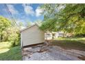 Side view of a residential home with ample outdoor space, showcasing its setting and structure at 2194 Ivydale St, Atlanta, GA 30344