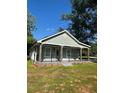 Inviting single-story home featuring a covered porch with stone accents and black iron railings at 4321 Austell Powder Springs Sw Rd, Powder Springs, GA 30127