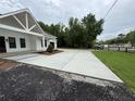Long concrete driveway leading to a charming one-story house, offering ample parking space at 4824 Highway 20 Se, Conyers, GA 30013