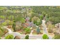 A stately brick and stone home nestled among the trees in a quiet neighborhood at 800 Flathead Pass, Suwanee, GA 30024