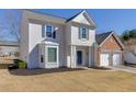 Charming two-story home featuring a combination of white siding and brick, plus an attached two-car garage at 230 Ascalon Ct, Johns Creek, GA 30005