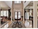 Grand foyer with soaring ceilings, hardwood floors, and elegant architectural details at 2510 Bent Creek Way, Cumming, GA 30041
