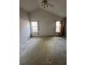Bedroom with vaulted ceiling, natural light from two windows, carpet, and neutral walls at 4401 Chestnut Lake Ave, Lithonia, GA 30038