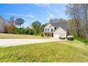 Charming two-story home featuring a well-maintained lawn and attached two car garage at 235 Hastings Ct, Mcdonough, GA 30252