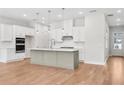 Bright kitchen with stainless steel appliances, white cabinets and a large gray kitchen island at 2540 Silver Star Ne Dr, Marietta, GA 30066