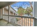 Balcony view showing a parking lot and wooded area in the background at 66 Fair Haven Se Way, Smyrna, GA 30080
