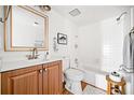 Bathroom boasts a tub-shower combination and a natural wood vanity at 66 Fair Haven Se Way, Smyrna, GA 30080