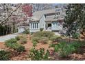 Inviting front exterior showcases a beautifully landscaped yard and classic architectural design at 80 Seville Chase, Atlanta, GA 30328