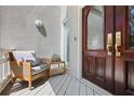 Cozy front porch featuring stylish seating and a charming view at 80 Seville Chase, Atlanta, GA 30328