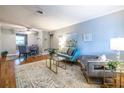 Open-concept living room and dining area with hardwood floors and neutral decor at 520 Park Se Ave # 10, Atlanta, GA 30312