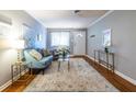 Cozy living room featuring hardwood floors, a comfortable sofa, and ample natural light at 520 Park Se Ave # 10, Atlanta, GA 30312