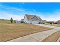 Well-maintained home with a two-car garage, spacious lawn, and a shed at 95 Summerlyn Dr, Hiram, GA 30141