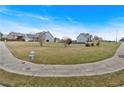 Expansive front lawn of a residential property with mature trees in a serene neighborhood setting at 95 Summerlyn Dr, Hiram, GA 30141