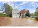 Charming split-level home featuring a two-car garage and landscaped yard at 104 Puckett Creek Dr, Canton, GA 30114