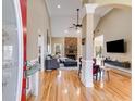 Bright, open living room boasts hardwood floors, stone fireplace and vaulted ceilings at 1409 Northgate Dr, Villa Rica, GA 30180