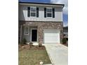 Modern two-story home featuring a brick facade, single-car garage, and manicured lawn at 3017 Acacia Cir, Douglasville, GA 30135