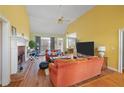 Inviting living room with vaulted ceilings, a brick fireplace, and hardwood floors, perfect for relaxing at 2503 Westchester Se Way, Conyers, GA 30013