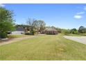 Expansive lawn leading to a well-maintained brick home, perfect for outdoor activities and enjoyment at 2503 Westchester Se Way, Conyers, GA 30013