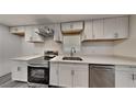 Modern kitchen featuring stainless steel appliances and bright white cabinets at 4193 Port Chester Way, Decatur, GA 30034