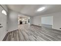 Bright open-concept living area with wood-look floors connects the kitchen and living spaces at 4193 Port Chester Way, Decatur, GA 30034