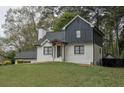 A well-kept, two-story house with fresh paint and landscaping at 2048 Kelvin Dr, Lawrenceville, GA 30043