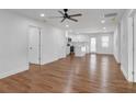 Open-concept living space with hardwood floors seamlessly flowing into the modern kitchen at 2095 Highway 20 Ne, Conyers, GA 30012