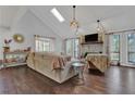 Bright living room features vaulted ceilings, skylight, stone fireplace, and hardwood floors at 2806 Peachtree Walk, Duluth, GA 30096