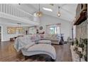 Bright living room with high ceilings, a stone fireplace, hardwood floors, and stylish decor at 2806 Peachtree Walk, Duluth, GA 30096