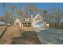 Attractive two-story home with a spacious driveway and manicured front yard at 338 Rc Thompson Rd, Dallas, GA 30157