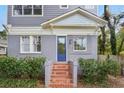 Charming home featuring a mix of siding and brick and front steps with tiles at 811 Ponce De Leon Ne Pl, Atlanta, GA 30306
