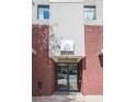 Building entrance with brick facade, large windows and prominent building number at 335 W Ponce De Leon Ave # 506, Decatur, GA 30030