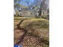 Spacious backyard with room for outdoor activities and potential landscaping enhancements at 1253 Gus Thornhill Jr Dr, Atlanta, GA 30344