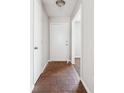 Entryway with neutral walls, a white door, and tile flooring leading to carpeted space at 1360 Cypress Ridge Cir, Stone Mountain, GA 30083
