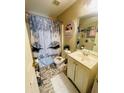 Quirky bathroom featuring marble tile flooring, modern fixtures, and an eye-catching shower curtain at 2742 Snapfinger Manor, Decatur, GA 30035