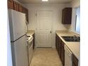 Functional kitchen with white appliances, ample cabinet space, and a view to the adjoining room at 10303 Waldrop Place, Decatur, GA 30034