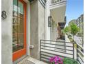 Charming front porch with a vibrant orange door and well-maintained landscaping at 8 Bass Se St, Atlanta, GA 30315