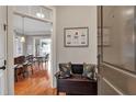 Inviting foyer with hardwood floors and stylish decor, including a bench with decorative pillows at 3635 E Paces Ne Cir # 1308, Atlanta, GA 30326