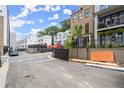 View of new construction street with modern townhomes and construction barriers at 1770 Beckham Ne Pl # 47, Atlanta, GA 30324