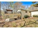 Expansive backyard boasting a covered patio and elevated deck, ideal for outdoor entertaining and enjoying nature at 481 Patillo Rd, Stockbridge, GA 30281