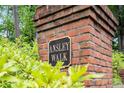 Ansley Walk neighborhood sign displayed on a brick structure surrounded by greenery at 432 Ansley Walk Ne Ter, Atlanta, GA 30309