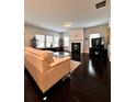 Spacious living room with hardwood floors, a fireplace, ample natural light, and comfortable seating at 3049 Morgan Spring Trl, Buford, GA 30519