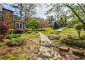 Landscaped front yard with walkway leading to the home in a quiet neighborhood at 4183 Oak Crest Dr, Tucker, GA 30084